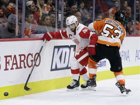 Detroit Red Wings' Henrik Zetterberg (40) tries to slip past Philadelphia Flyers' Shayne Gostisbehere (53) during the third period of an NHL hockey game, Wednesday, Dec. 20, 2017, in Philadelphia. Philadelphia won 4-3.