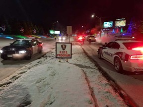 Windsor Police Service and Essex County OPP vehicles at a RIDE stop in Windsor on the night of Dec. 27, 2017.