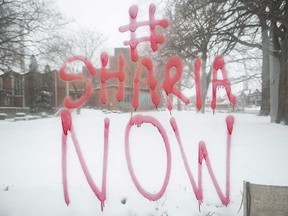 Islamic-themed graffiti that was spray-painted on a bus shelter at Ouellette Avenue and Erie Street on Dec. 13, 2017.