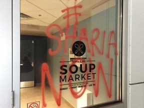 Graffiti that was spray-painted on the doors of the Windsor Star and News Cafe building on Ouellette Avenue during the early morning hours of Dec. 13, 2017. The message reads: "#Sharia Now."