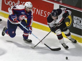Windsor Spitfires forward Mathew MacDougall, at left chasing Saginaw's D.J. Busker, had three goals on Saturday, including the overtime winner, as the Spitfires snapped a seven-game losing streak.