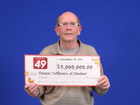 Thomas Tofflemire of Windsor with his $2-million prize cheque for winning the Ontario 49 jackpot of Dec. 9, 2017.