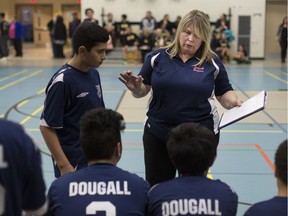 Chris Papadopoulos coaches the boys volleyball team from Dougall Public School as they take on McWilliam Public School, Monday, Dec. 4, 2017.