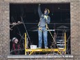 Workers concentrate on window replacement at the former Veterans Affairs office on University Avenue West on Monday, December 4, 2017. The building is undergoing extensive renovations worth $10.8 million. The bulk of the new occupants at 441 University Ave. W., will be about 300 Canada Revenue Agency employees vacating the Paul Martin Building a few blocks away at 185 Ouellette Ave., next spring. Also making the move is a Public Services and Procurement Canada facility manager and four wildlife enforcement employees with Environment and Climate Change Canada. The new Veterans Affairs office is located at 1 Riverside Dr. W.