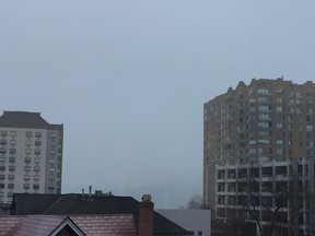 In this photo, taken from Windsor's downtown Sunday, fog has obscured  Renaissance Center from Detroit's skyline.