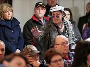 Performer Michelle Mainwaring, standing,  was one of the first to offer a personal donation as hundreds of current, past and future members of Stoney Point Sportsmen's Club attended a meeting to discuss the financial woes of the popular club on Lake St. Clair on Saturday, Jan. 6, 2018.