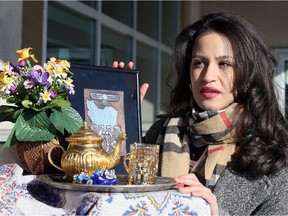 Nikki, a Windsor student with Iranian family roots, wants Canadians to pay more attention to the protests currently underway in the streets of the Middle Eastern nation headed by fundamentalist clerics. Here. she's shown Jan. 6, 2017, with some mementos of her parents' homeland.