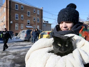 Courtney Dumeah and pet Shiloh were evacuated from their apartment following a fire at 1534 Ouellette Avenue, Jan. 6, 2018.  Windsor firefighters and Essex-Windsor EMS paramedics responded to the fire which caused smoke damage to many of the units in the three-storey apartment building.
