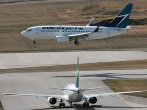 A WestJet Boeing 737 lands at Calgary International Airport on May 3, 2009.