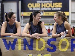 Windsor Lancers Kelsey Balkwill, at centre between Courteney Rivait, left, and Alexia Lamothe, right, chat during Can Am Classic at University of Windsor on Saturday. (NICK BRANCACCIO/Windsor Star)   See Parker story.