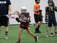 Lacrosse player Izabella King, 8, left, prepares to catch a pass during a free clinic held by Windsor Minor Lacrosse Assoc. at Central Park Athletics on Jan. 21, 2018. King was participating with about 30 players aged three to 13.  The lacrosse players were under the guidance of Windsor Clippers head coach Jerry Kavanaugh.
