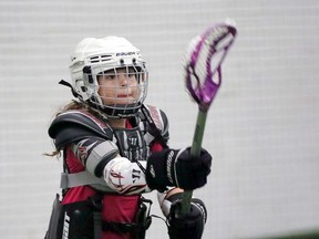 Lacrosse player Izabella King, 8, passes the ball during a free clinic held by Windsor Minor Lacrosse Assoc. at Central Park Athletics Sunday. King was participating with with a group of 30 players aged 3-13 years.  The lacrosse players were under the guidance of Windsor Clippers head coach Jerry Kavanaugh.