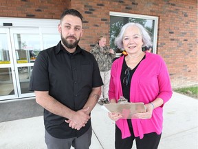 Matt Kelly, left, Lived Experience speaker at Not My Kid: Opioids and Adolescents Community Forum chats with Roberta Jarecsni, South Shore Health Centre at Kingsville Community Centre on May 24, 2017.