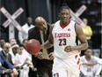Windsor Express Shaquille Keith is encouraged by head coach Bill Jones, behind, in NBL Canada game against London Lightning at WFCU Centre on Sunday.