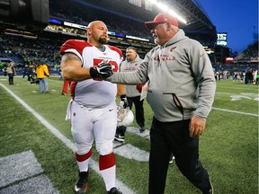 Arizona Cardinals head coach Bruce Arians greets A.Q. Shipley  after their win over the Seattle Seahawks at CenturyLink Field on December 31, 2017 in Seattle, Washington. The Arizona Cardinals beat the Seattle Seahawks 26-24.