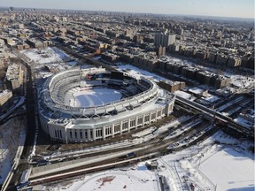 Yankee Stadium stands under a blanket of snow on Jan. 5, 2018 in the Bronx Borough of New York City. The Yankees will extend the netting behind home plate to better protect fans.