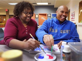 Cecilia Banks paints with her husband Don Banks who participates in programs at the Alzheimer Society of Windsor and Essex County on Tuesday, Jan. 9, 2017.