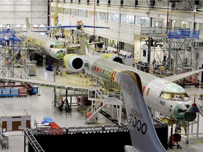 People tour the Bombardier Global 7000 aircraft and facility in Toronto on Nov.r 3, 2015.