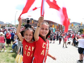 Canada Day will be celebrated throughout Windsor and Essex County July 1. Here, Sianna Chiandussi (left) and Ahliya Chiandussi are all smiles as they celebrated Canada Day in this file photo.