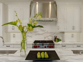 This Jennifer Gilmer kitchen featuring honed marble counters is on the cover of Gilmer's book "The Kitchen Bible: A Guide to Designing the Perfect Culinary Space."