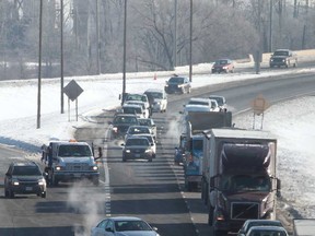 Traffic in the westbound lanes of the E.C. Row Expressway is shown in this February 2014 file photo.