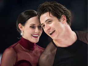 Tessa Virtue and Scott Moir skate off the ice after performing their free dance during the senior ice dance competition at the Canadian Figure Skating Championships in Vancouver, B.C., on Jan. 13, 2018.