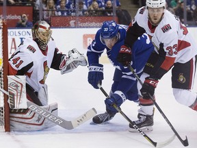 Toronto Maple Leafs centre Frederik Gauthier and Ottawa Senators defenceman Fredrik Claesson race for the puck in front of goaltender Craig Anderson on Jan. 10, 2018