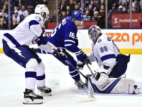 Tampa Bay Lightning goaltender Andrei Vasilevskiy (88) makes a save on Toronto Maple Leafs centre Mitchell Marner (16) as Lightning's Victor Hedman (77) defends during second period NHL hockey action in Toronto on Tuesday, January 2, 2018.