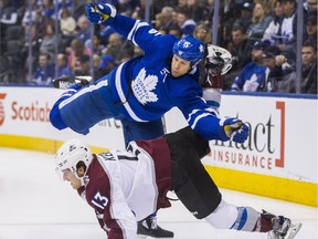 Toronto Maple Leafs Matt Martin during 1st period action against Colorado Avalanche Alexander Kerfoot at the Air Canada Centre in Toronto, Jan. 22, 2018.