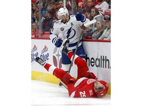 Tampa Bay Lightning right wing Ryan Callahan (24) checks Detroit Red Wings defenseman Mike Green (25) in the first period of an NHL hockey game Sunday, Jan. 7, 2018, in Detroit.