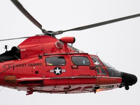 A U.S. Coast Guard helicopter in flight.