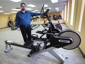 Ron Dunn, executive director of the Downtown Mission, shows off equipment in the new fitness facility at the organization's Ouellette Avenue location.