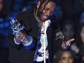 FILE - In this Sunday, Aug. 27, 2017 file photo, Kendrick Lamar accepts the award for video of the year for "HUMBLE." at the MTV Video Music Awards at The Forum in Inglewood, Calif. Four of the five album of the year nominees at the 2018 Grammys are rap and R&B-based albums from black or Latino artists, including Lamar.