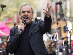 FILE - In this Oct. 20, 2014 file photo, Neil Diamond performs on NBC's "Today" show in New York. Diamond is retiring from touring after he says he was diagnosed with Parkinson's disease. Days shy of his 77th birthday, the rock legend is canceling his tour dates in Australia and New Zealand for March. He was on his 50th anniversary tour. Diamond turns 77 on Wednesday and will get the lifetime achievement award at Sunday's Grammy awards.