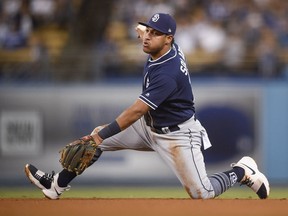 In this Sept. 25, 2017, file photo, San Diego Padres third baseman Yangervis Solarte holds on to the ball after catching a line drive hit by Los Angeles Dodgers' Cody Bellinger during a game in Los Angeles. The Toronto Blue Jays acquired Solarte from the Padres on Jan. 6, 2018, for prospects Edward Olivares and Jared Carkuff.
