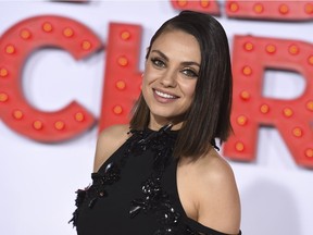 FILE - In this Oct. 30, 2017 file photo, Mila Kunis arrives at the Los Angeles premiere of "A Bad Moms Christmas." Kunis has been named Woman of the Year by Harvard University's Hasty Pudding Theatricals. She'll be honored Jan. 25 with a parade through Cambridge followed by a roast at which she will receive her pudding pot.
