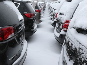 Chrysler Pacifica models, left, and Dodge Grand Caravan, right, are shown at the Motor City Chrysler dealership in Windsor, ON. on Wednesday, January 3, 2018.