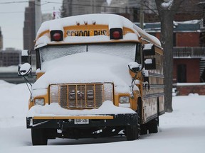 A school bus covered in snow in Windsor in February 2011.