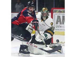 The Windsor Spitfires Luke Boka is stopped by London Knights' goalie Joseph Raaymakers during Thursday's game at the WFCU Centre.