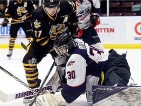 Windsor Spitfires goalie Lucas Patton tries to make a save on Sarnia Sting's Drake Rymsha (17) in the first period at Progressive Auto Sales Arena ion Friday.
(Mark Malone/Chatham Daily News/Postmedia Network)