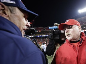 Tennessee Titans head coach Mike Mularkey, left, and Kansas City Chiefs head coach Andy Reid talk after their NFL wild-card playoff football game Saturday, Jan. 6, 2018, in Kansas City, Mo.