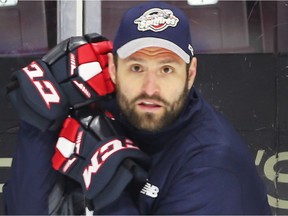 Former Windsor Spitfire captain and retired NHL player Mike Weber has signed a new three-year deal to stay on as an assistant coach with the club.