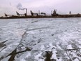 Ice forms on the Detroit River in front of Zug Island in this file photo.