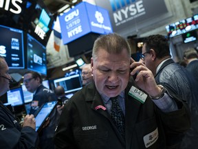 Traders work on the floor of the New York Stock Exchange on Friday, Feb. 2, 2018.