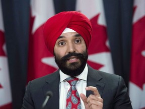 Navdeep Bains, Minister of Innovation, Science and Economic Development, shown in Ottawa on Dec. 12, 2017, will announce the winners Thursday of a competition to form technology "superclusters" — a decision that comes with $950 million in federal funding.