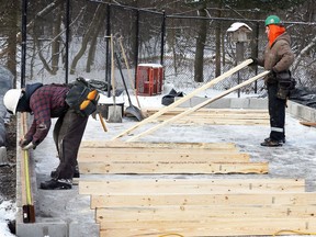 Carpenters Matt Bouma, left, Daryl Presley of Front Contractors build a new storage shed at Ojibway Nature Centre February 5, 2018. The original shed was lost during a recent fire. The shed is a popular location for photographers looking for action shots of birds who visit the feeders nearby.