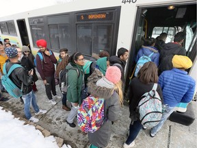 Leamington is planning a daily bus service to St. Clair College in Windsor. In this file photo from February, 2018, college students are seen boarding Transit Windsor's busy Dominion 5 bus.