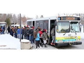 St. Clair College students crowd into a Transit Windsor Dominion 5 bus at the St. Clair College main campus on Feb. 13, 2018. The sudden rise in students using South Windsor buses resulted in some regular Transit Windsor users being bypassed by full buses.