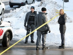 Windsor Police investigate following the discovery of a body in an alley on Church Street on Feb. 14, 2018.