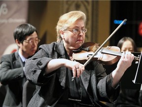 WSO's Concertmaster Lillian Scheirich plays with other violins during 2018-19 Season Launch event at Capitol Theatre February 22, 2018.